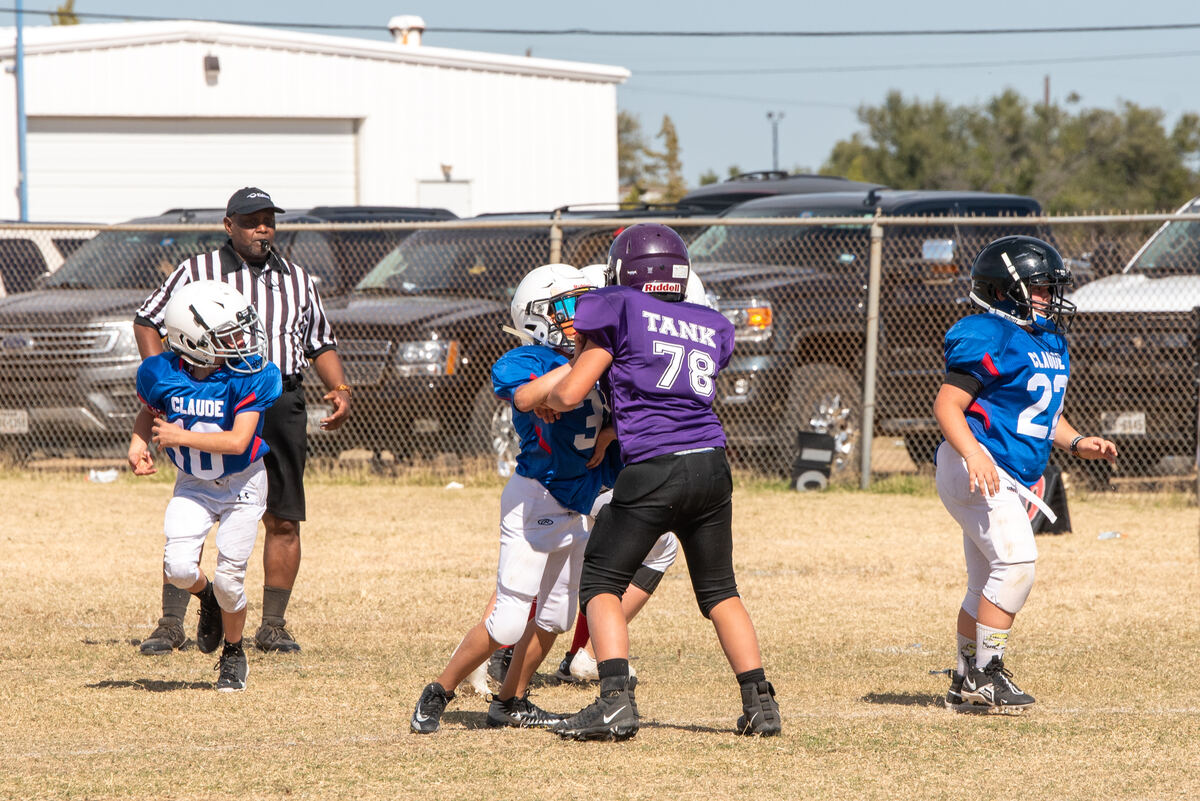 Tackle football players in a blocking battle